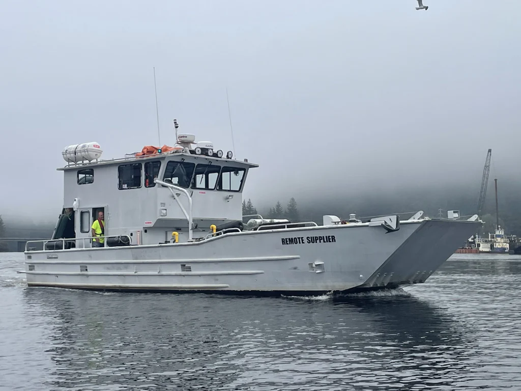 Remote Made Easy boat with workers in-route to a delivery on a foggy day.