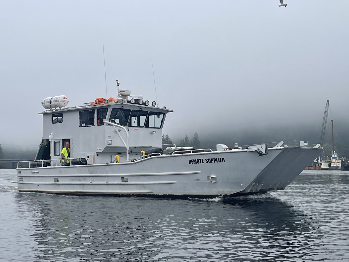 Remote Made Easy boat with workers in-route to a delivery on a foggy day.